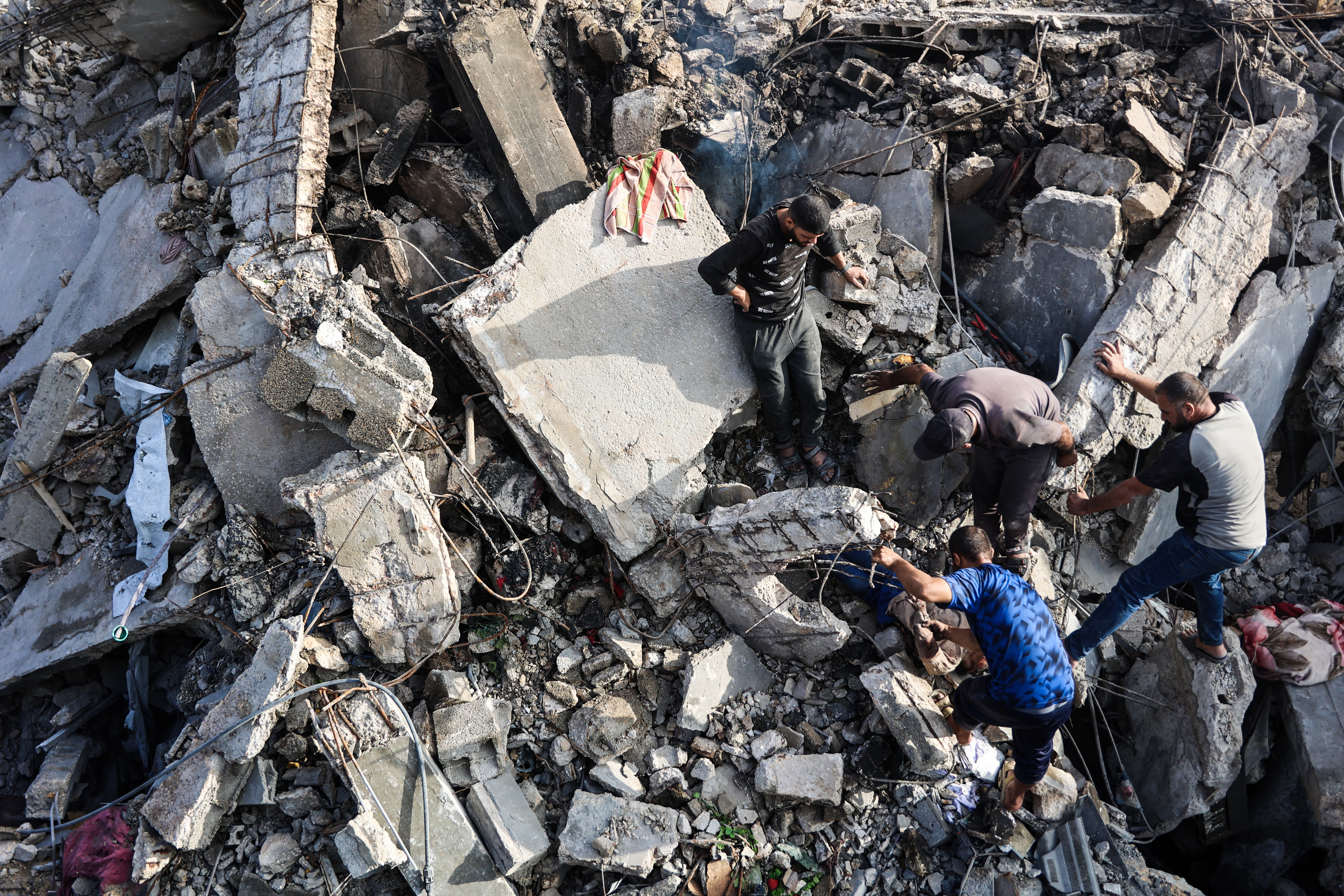 Palestinians recover a body from the rubble of a house destroyed in an Israeli overnight strike in Gaza, Oct. 29, 2025. (Credit: Omar al-Qataa/AFP)
