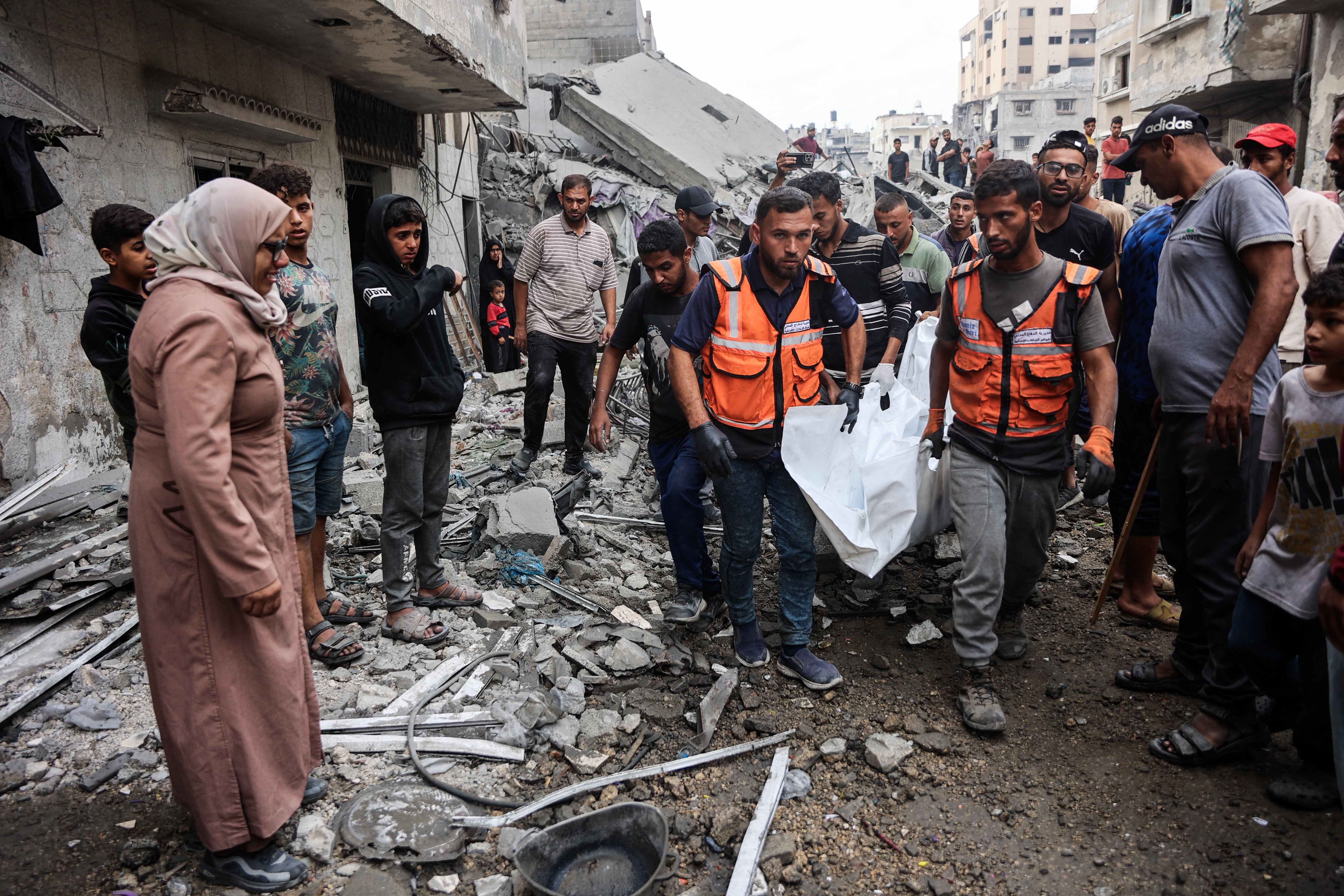 Palestinians carry bodies recovered from the rubble of a house destroyed in an Israeli overnight strike in Gaza, Oct. 29, 2025. (Credit: Omar al-Qataa/AFP)