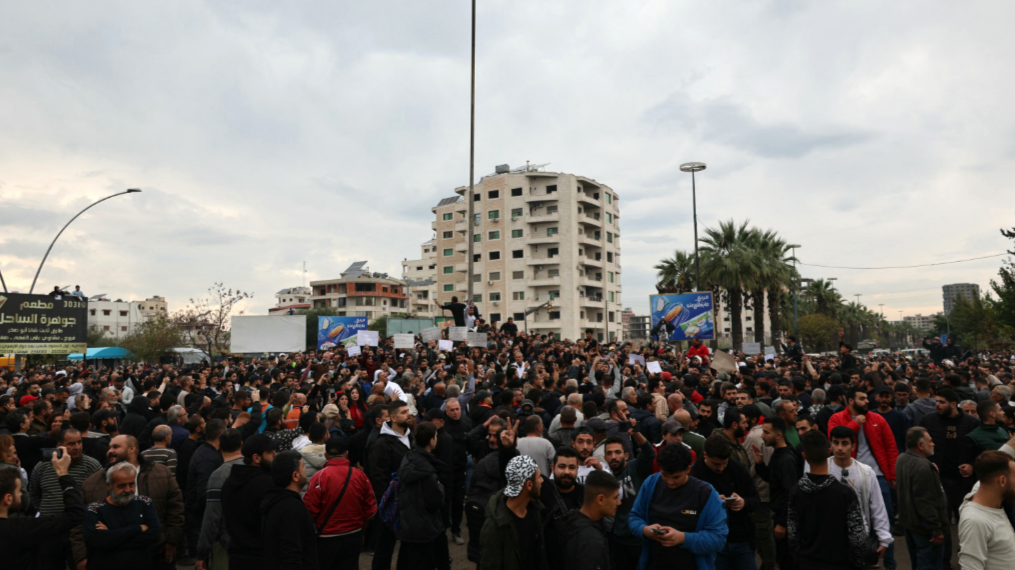 Syrian security forces use gunfire to disperse rival protests in Alawite heartland