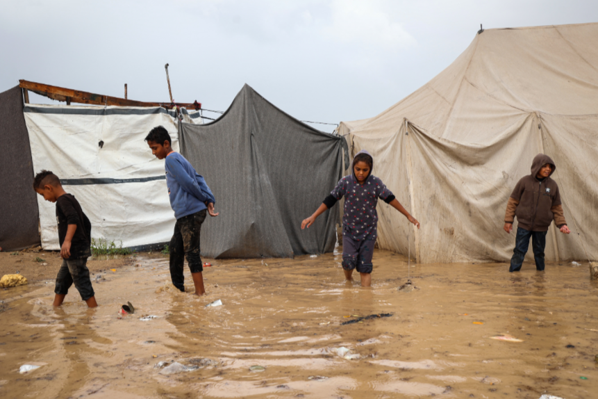 As winter looms, floods swamp tents of Palestinians forced from their homes by Israeli bombs