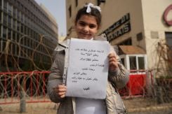 The daughter of a retired military officer demands an adjustment to her father's pension in front of Parliament on Jan. 27, 2026. (Credit: Mohammad Yassin/L'Orient-Le Jour)