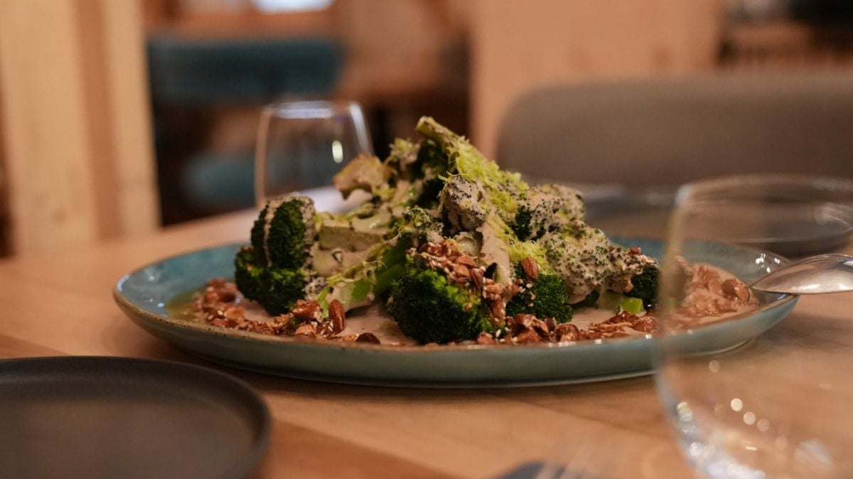 Broccoli with tahini and black garlic by chef Andrea Boueiz