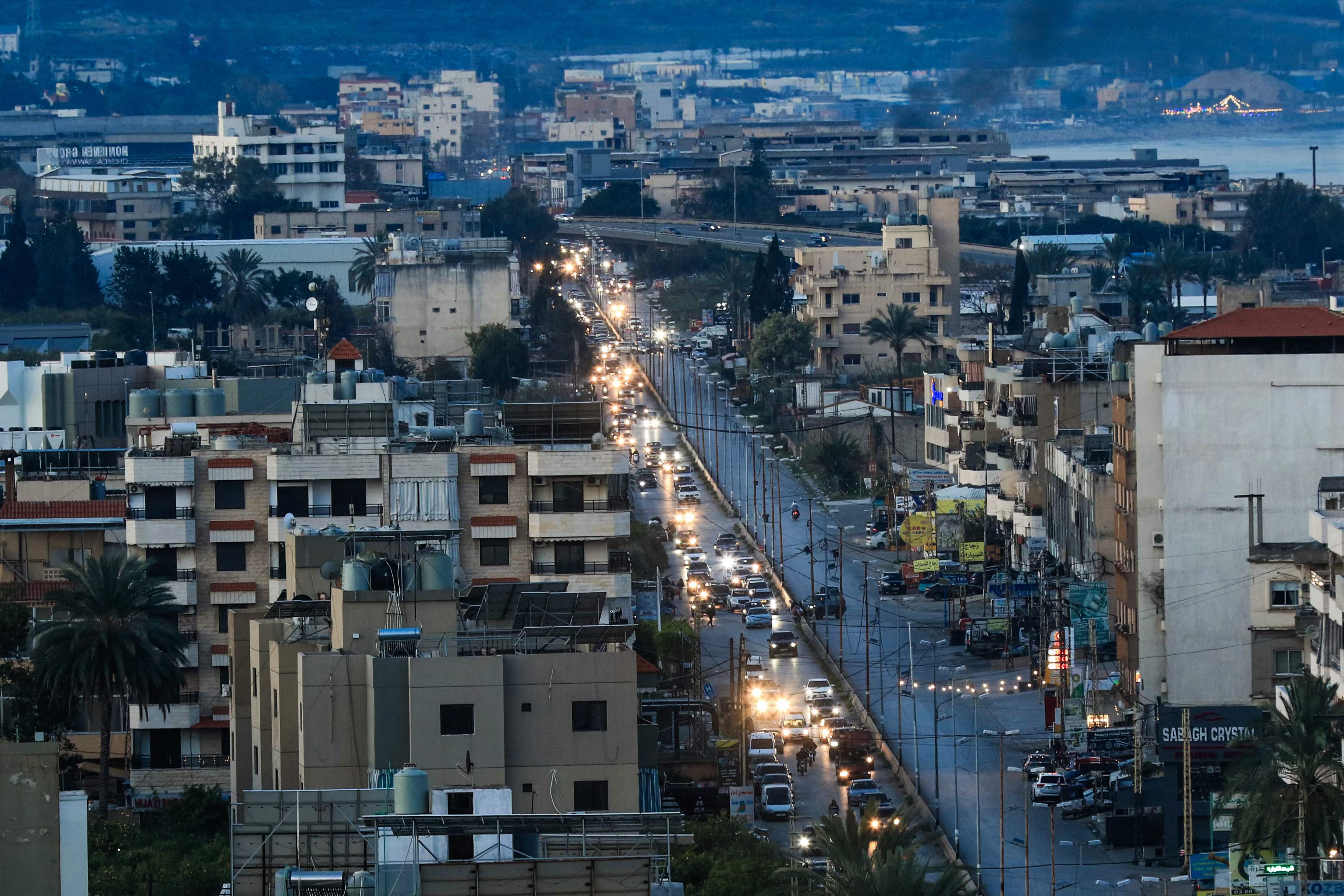 Motorists leave villages in southern Lebanon through the coastal city of saida on March 2, 2026. (Credit: AFP)