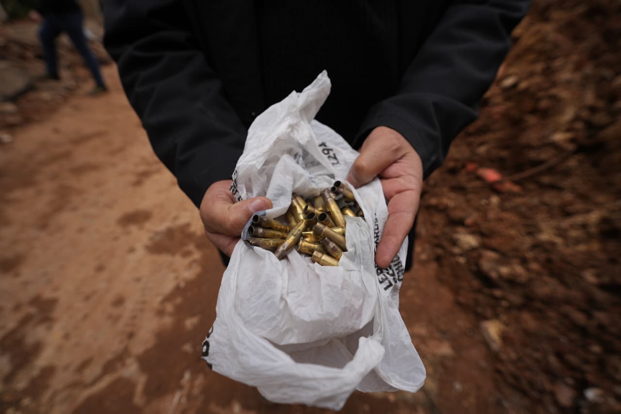 A resident shows shell casings he collected after clashes in Nabi Sheet. (Credit: Mohammad Yassine / L’Orient Today)