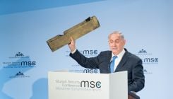 Israeli Prime Minister Netanyahu displays a metal piece at the Munich Security Conference, allegedly from an Iranian-made drone. (Credit: Wikicommons)