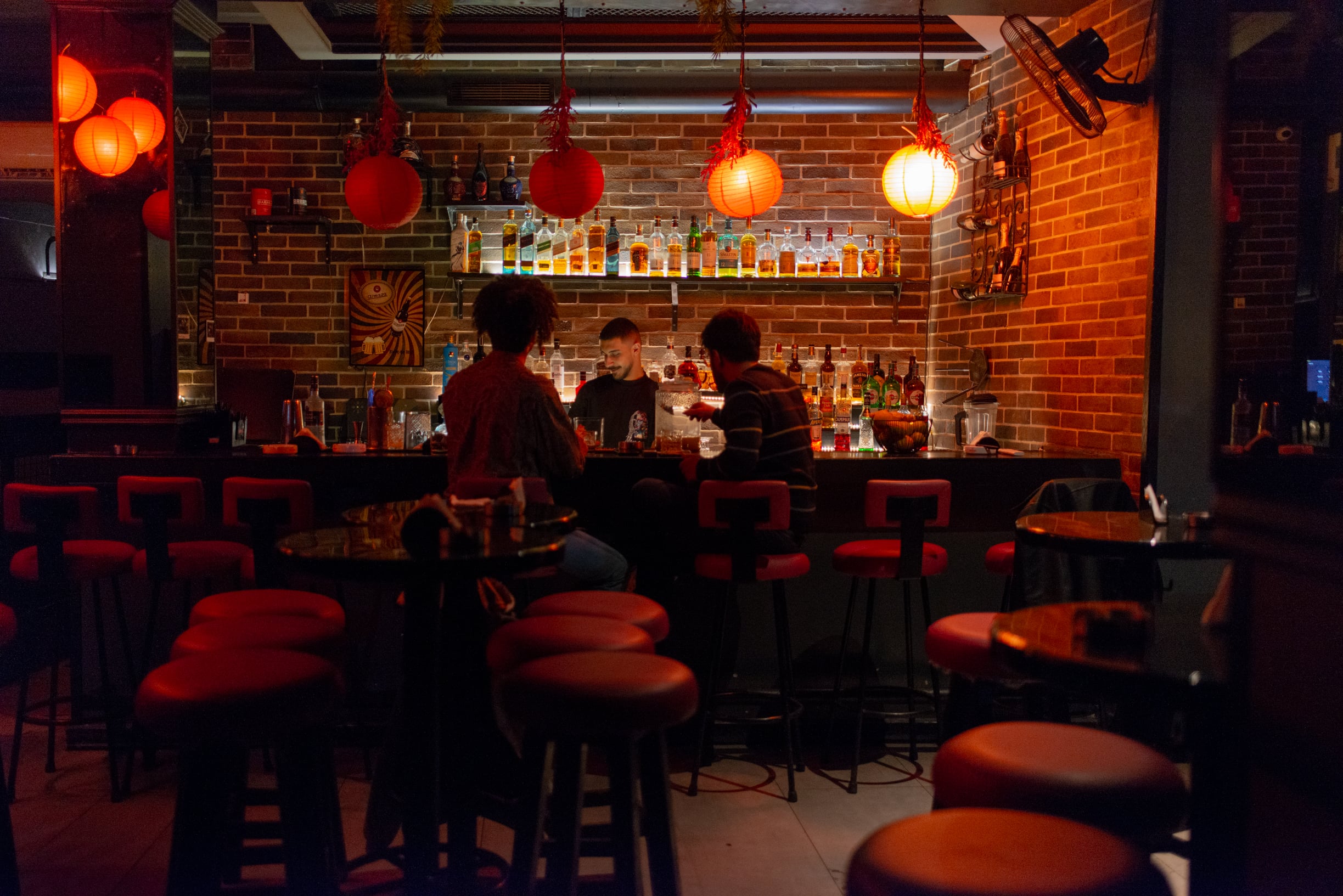 A bar usually packed on weekends has only two customers this Saturday night, in Mar Mikhael, on March 28, 2026. (Credit: Ségolène Ragu/L’Orient Today)