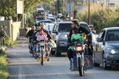 Vehicles pass through a military checkpoint in the al-Qasmieh area, heading towards southern Lebanon, early in the morning of April 8, 2026, after the two-week cease-fire agreement reached between the United States and Iran. (Credit: Kawnat HAJU/AFP)