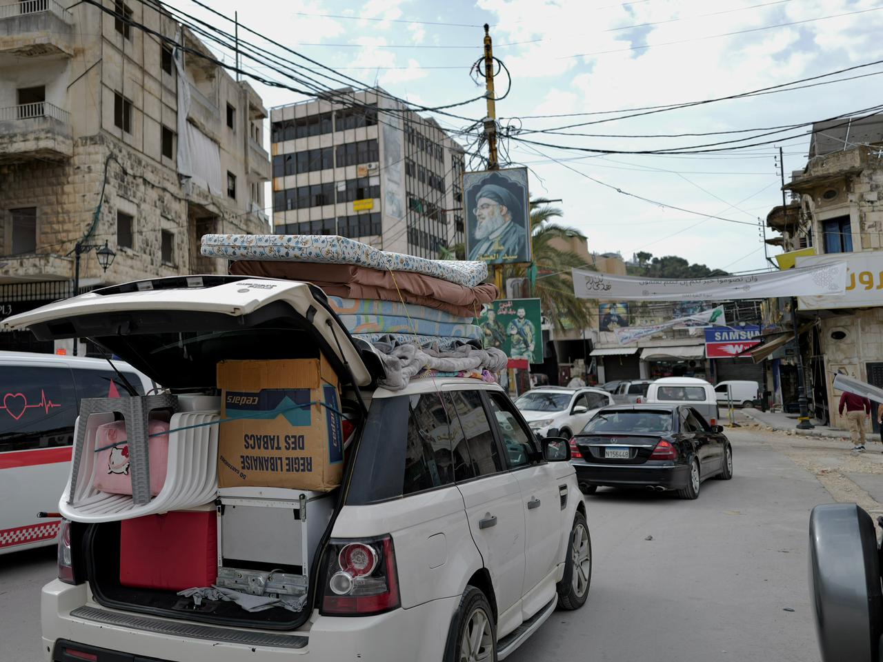 The road to Nabatieh is littered with houses destroyed by strikes. Residents' vehicles returning home kick up clouds of dust as they pass. 
(Credit: Mohammad Yassine/L'Orient Today)