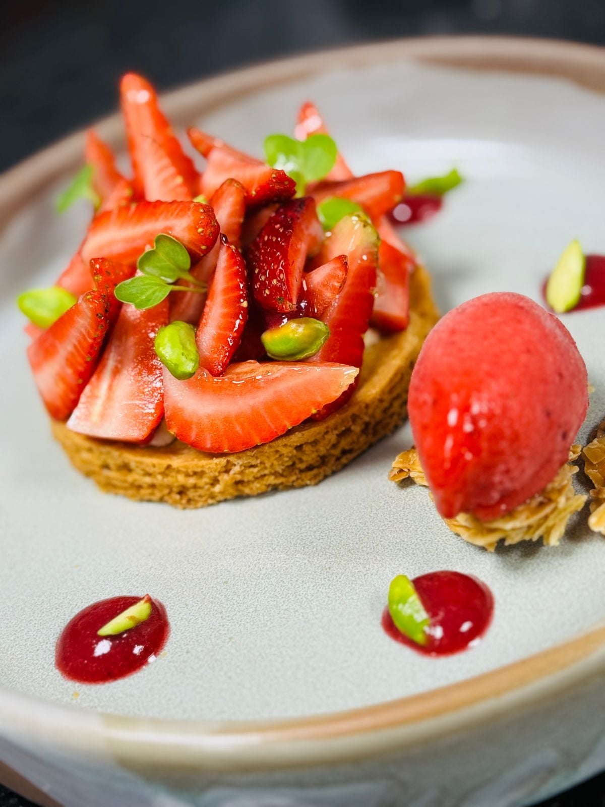 Charles Azar's strawberry pistachio tart on Breton shortbread, wild berry sorbet