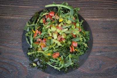 Summer salad on a bed of kale chips