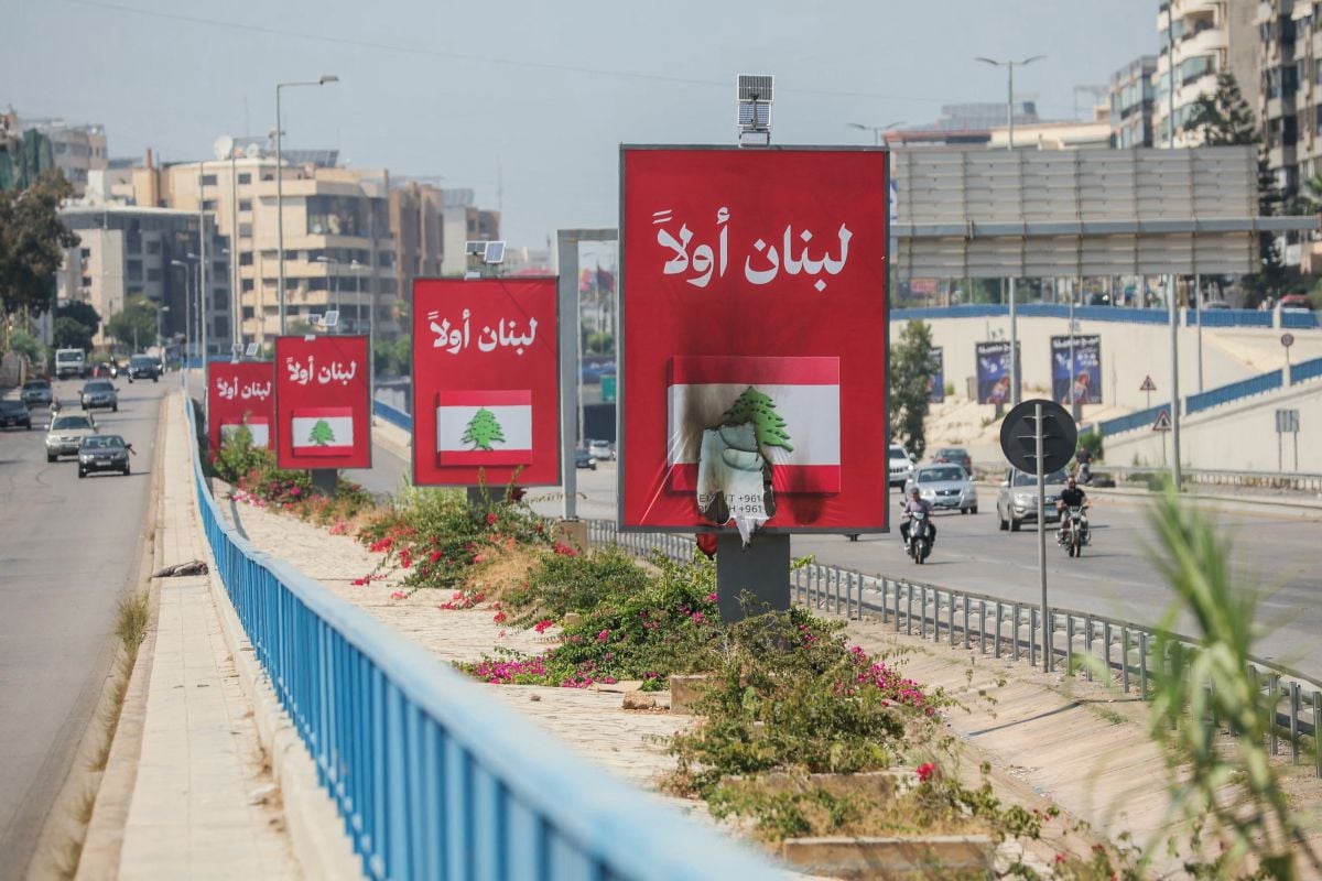 ‘Lebanon first’ billboards replace ‘Thank you, Iran’ signs on the road to Beirut airport — and set on fire