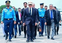 This handout photograph, taken and released by Pakistan's Prime Minister Office on July 3, 2026 shows Pakistan's Prime Minister Shehbaz Sharif (C), along with Foreign Minister Ishaq Dar (R), arriving for departure to Iran to attend the state funeral of late supreme leader Ali Khamenei from Nur Khan Air Base in Rawalpindi. (Photo: AFP)
