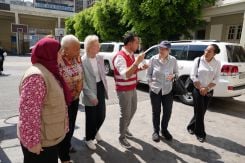 Graca Machel (second from left), Mary Robinson, former President of Ireland (third from left), and Helen Clark, former Prime Minister of New Zealand (second from right), are briefed by the Red Cross on the situation of the displaced in Southern Lebanon, on July 13, 2026, during a visit by the Elders to Lebanon. (Credit: Wael Kanj)
