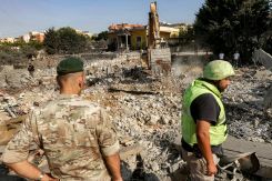 A Lebanese Army soldier stands next to a rescuer at the site of an overnight Israeli airstrike on the village of Kfar Roummane in southern Lebanon on Sept. 7, 2026. (Credit: Mahmoud Zayyat/AFP)
