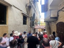 In the alleyways of the souks of Tripoli, visitors walk among the stalls of the old city. Photo Saad Tawil