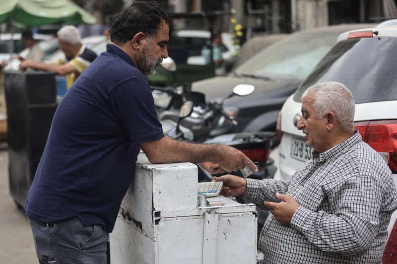 Iraq central bank devalues dinar after Middle East war hurts oil exports