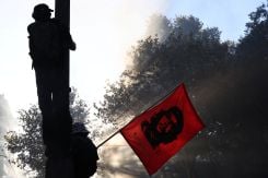 A protester waves a flag bearing the image of Cuban revolutionary Ernesto "Che" Guevara during a demonstration against the cost of living and rising fuel prices in Marseille as part of nationwide protests on Oct. 17, 2026. (Credit: Manon Cruz/Reuters)