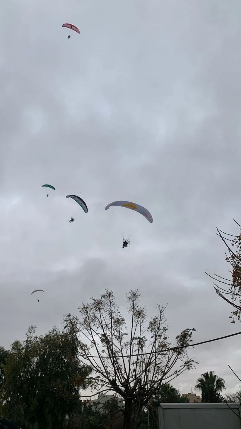 Syrian army paratroopers fly over Damascus
