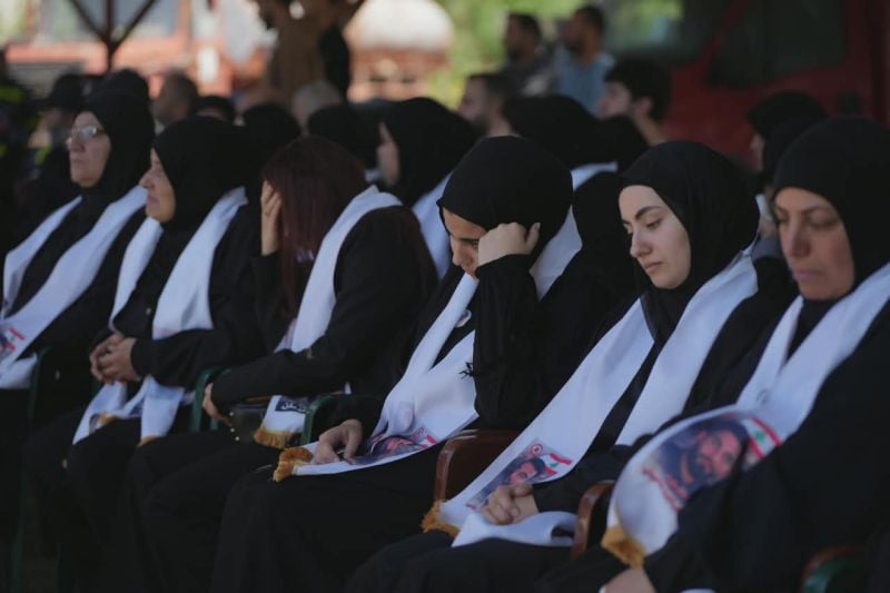At the funerals of rescuers killed Tuesday, a colleague vows the Civil Defense will 'continue to save every soul trapped under the rubble'
