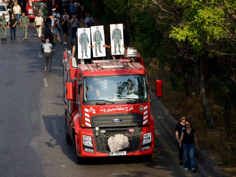 Fire trucks and demonstrators head toward Beirut port