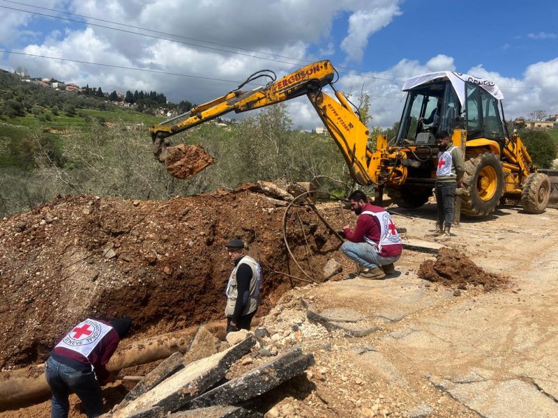International Committee of the Red Cros and others work to fix the water pipeline damaged by an Israeli strike