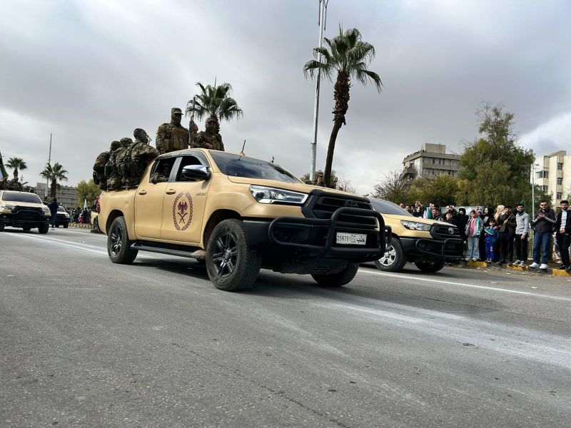 Syrian forces military parade through streets of Damascus